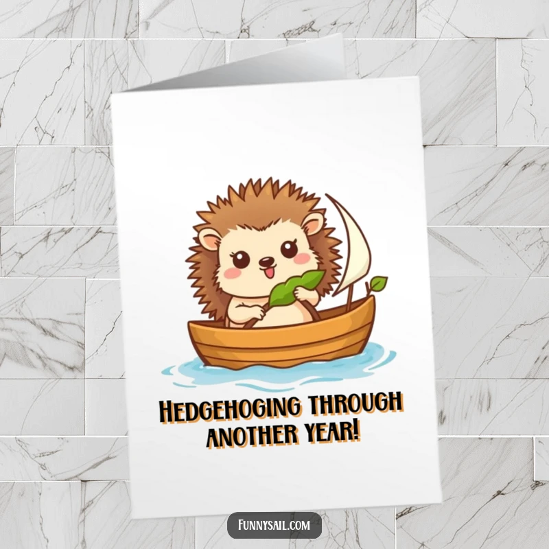 Funny Free Printable Hedgehog Sailor Birthday Card: A cheerful hedgehog steers a boat with a leaf sail, ready for birthday wishes.