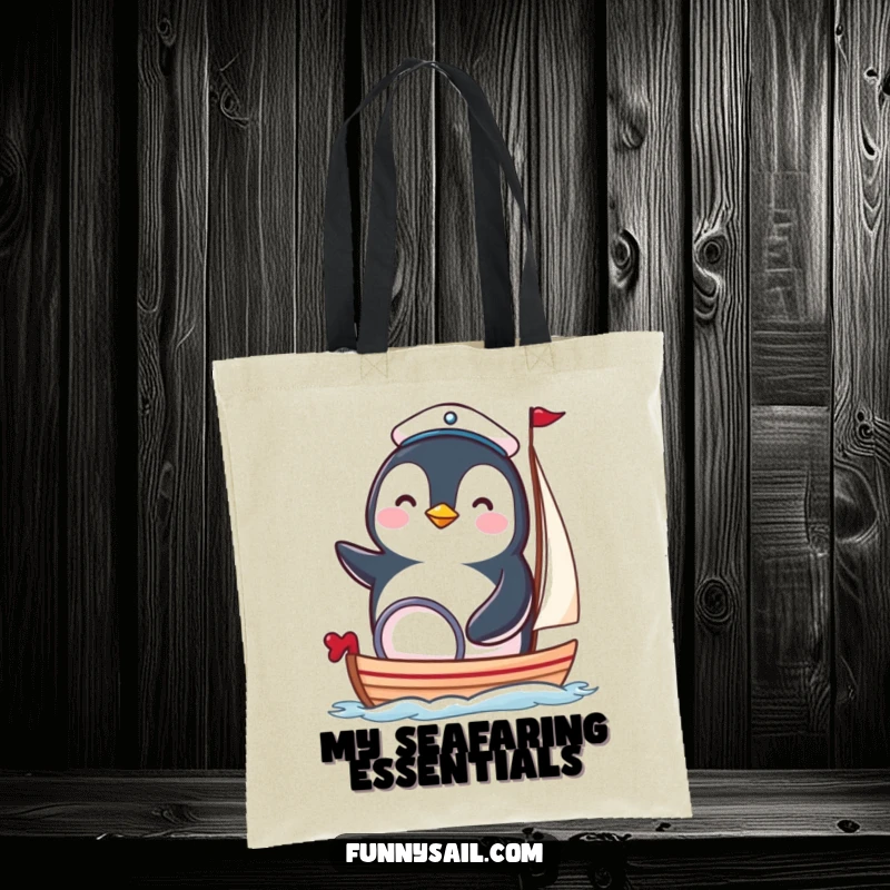 Funny penguin sailor tote bag featuring a happy bird in a tiny hat steering a miniature sailboat, ideal for carrying items.